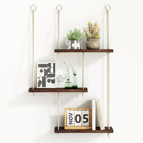 Fixwal three-tier hanging shelf displaying plants in a cozy living space.