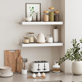 Bathroom storage with Fixwal white shelf for towels and essentials.