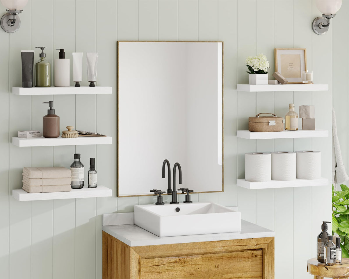 Fixwal white floating shelves in bedroom provide versatile storage and display space.