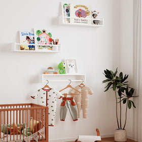 Fixwal white wall-mounted shelves displaying books and toys in a kid's room