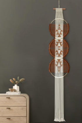 Flber macrame wall art brown white rounds creates cozy yet chic focal point.