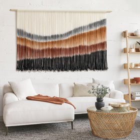 Flber handcrafted cotton cord tapestry delivers warm boho ambiance.