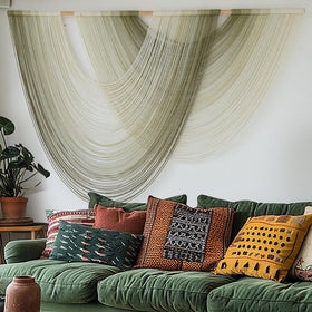 Flber macrame knots in double-curve silhouette create warm texture for bedrooms.