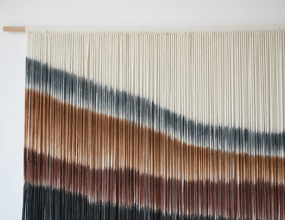 Flber tie-dye textile brightens walls with natural fiber texture.