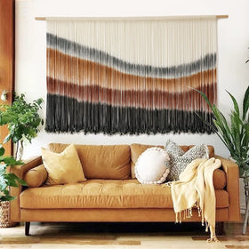 Flber macrame wall hanging in coffee brown tie-dye enhances cozy living spaces.