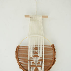 Flber three-circle macrame wall hanging fits bedrooms and studios elegantly.