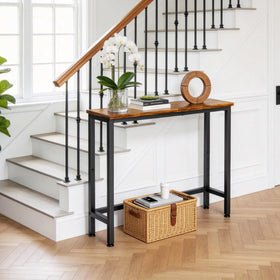 Flevra slim sofa table behind couch, convenient for drinks and remotes.
