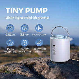 FLEXTAILGEAR Tiny Pump in action inflating a mattress during outdoor camping.