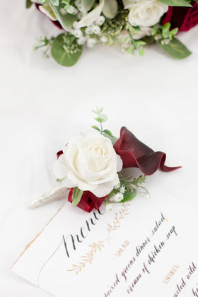 Floinla Burgundy boutonniere with calla lily and velvet rose for sharp formal accents.