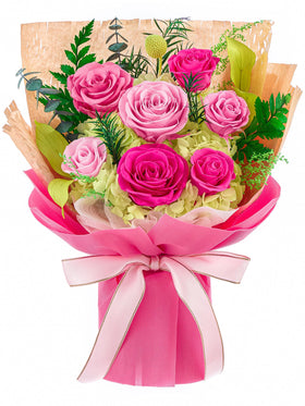 Flomoon Forever Flowers hot pink seven-rose bouquet on display adds lasting charm.