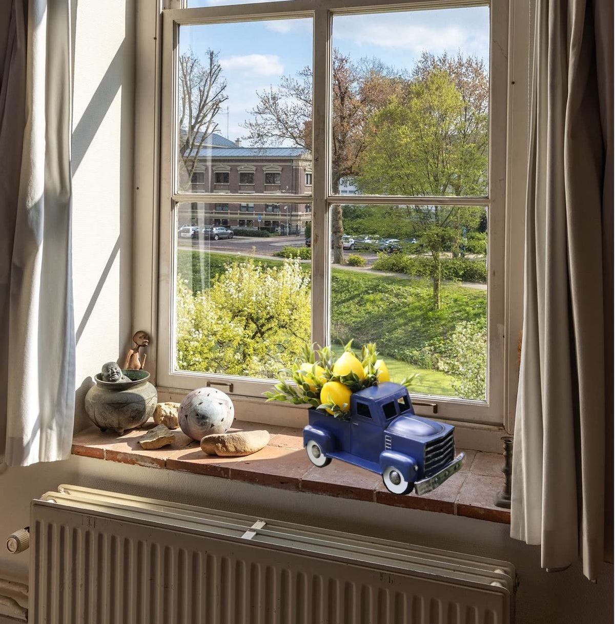 FLOROAD blue farmhouse truck brings spring vibes to living spaces.
