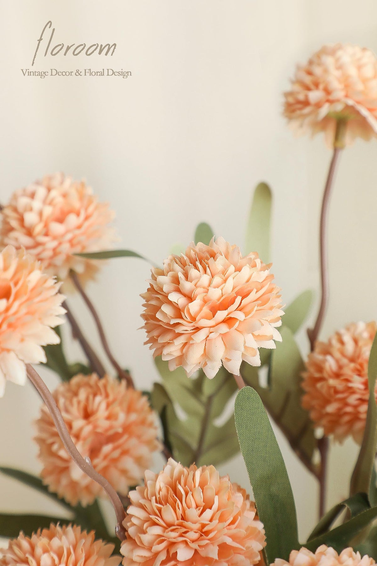 Floroom faux silk mums suitable for indoor and outdoor arrangements and repeated use.