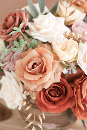 Floroom wedding arch garland setup with terracotta blooms for ceremony decor