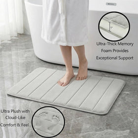 Flotstiga memory foam bath mat large 20x32 covers bathroom floor with cushion.