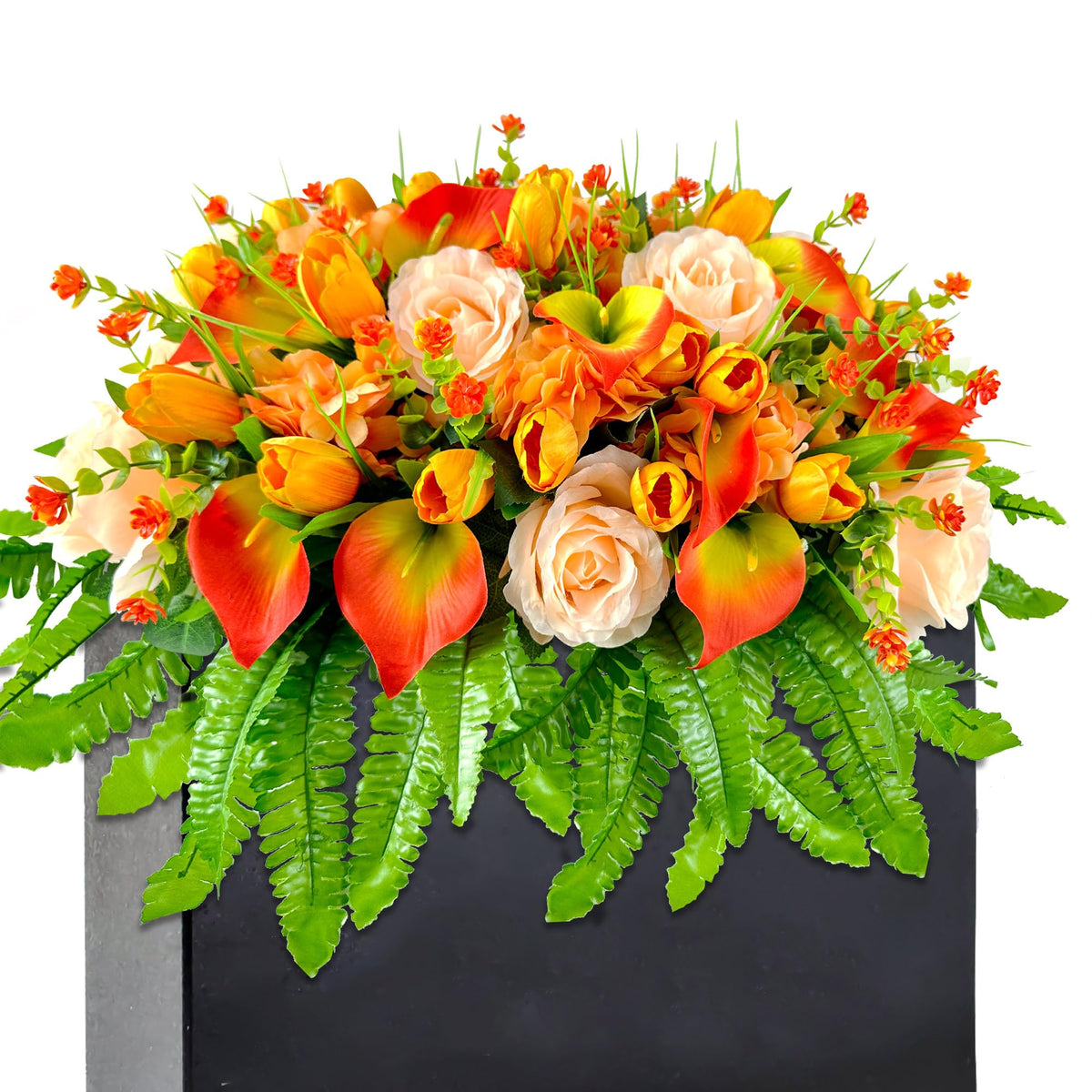 Floweria artificial cemetery flowers in orange roses and tulips on a grave saddle offer a durable outdoor display.