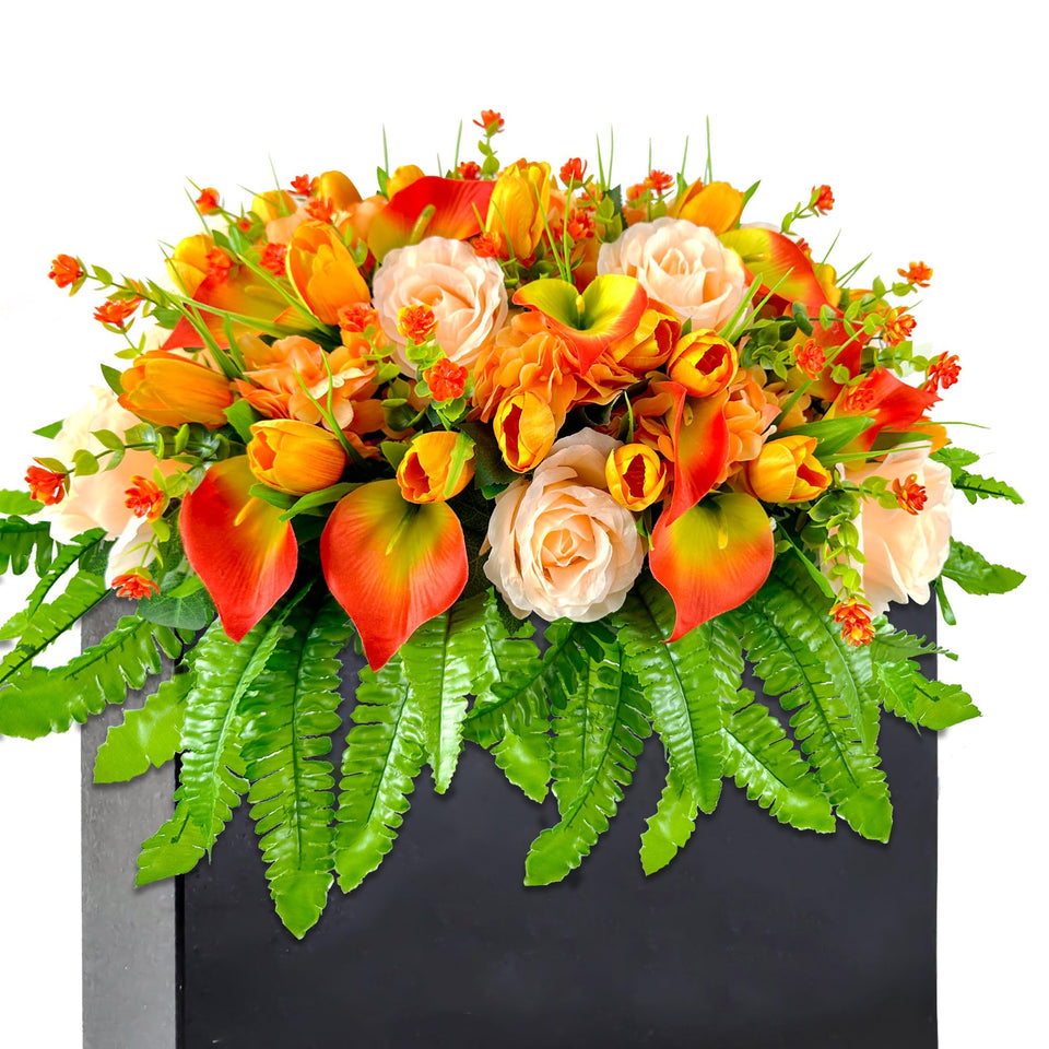 Floweria artificial cemetery flowers in orange roses and tulips on a grave saddle offer a durable outdoor display.