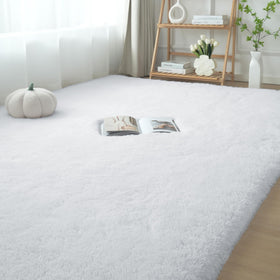 FluffyRug white fluffy area rug in a cozy bedroom setting for soft comfort