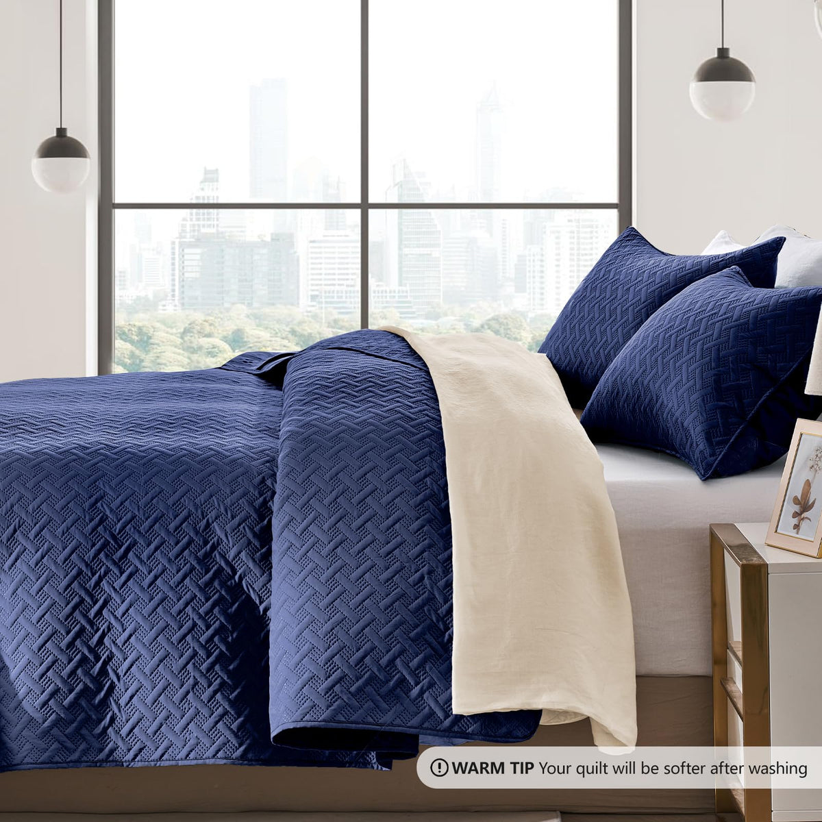 Two navy pillow shams 20x26 complete the quilt set