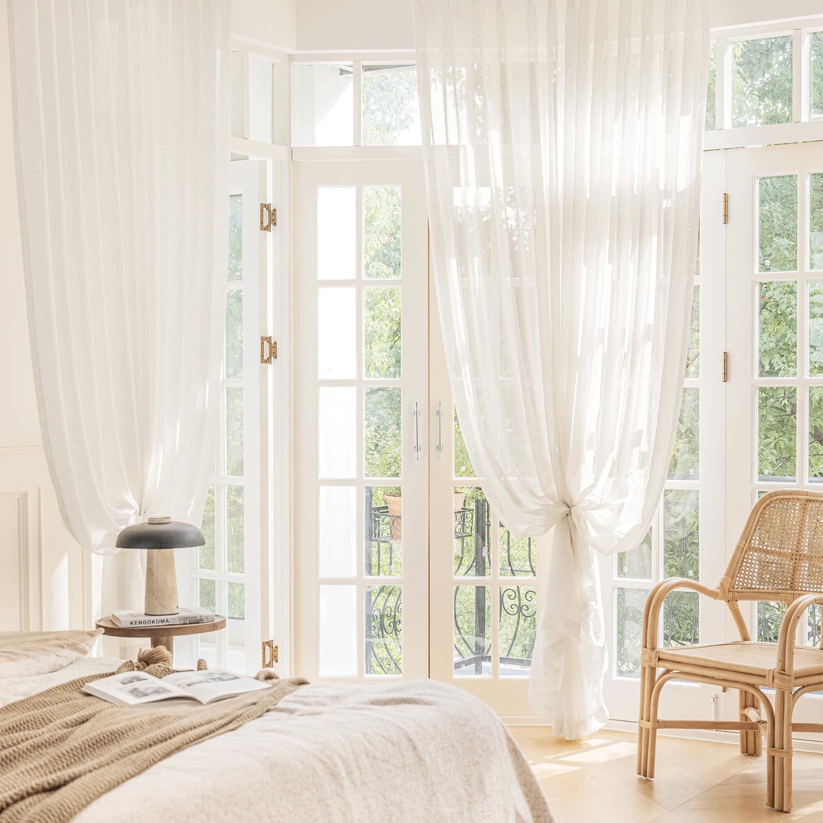 Natural light filters through linen, enhancing warm tones in the dining room