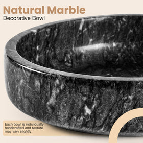 Marble bowl holding keys on a minimalist entryway console