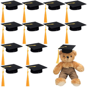 Foilswirl mini graduation cap with tassel in yellow for plush photo props.