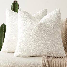 Foindtower boucle pillow cover in white adds soft texture to a sofa.