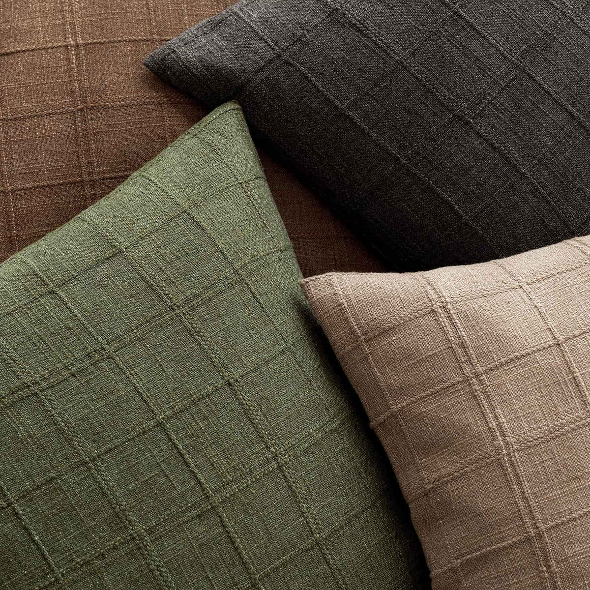 Foindtower check pillow cover olive green texture close-up highlighting tactile material.
