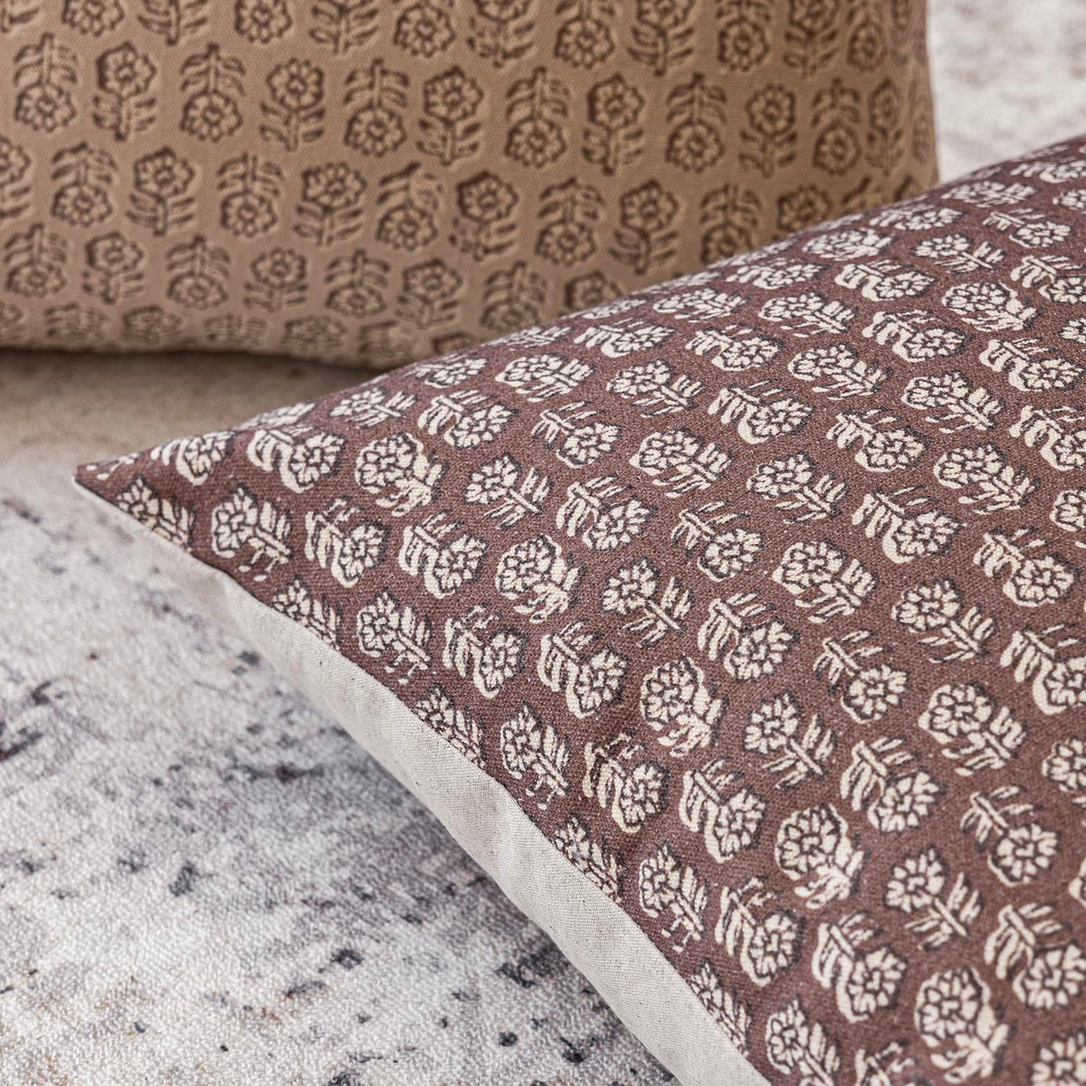 Foindtower pillow cover on sofa, modern vintage print elevating room ambiance.