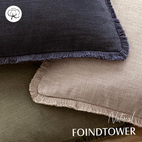 Foindtower fringe pillow cover on a sofa adds texture and warmth.
