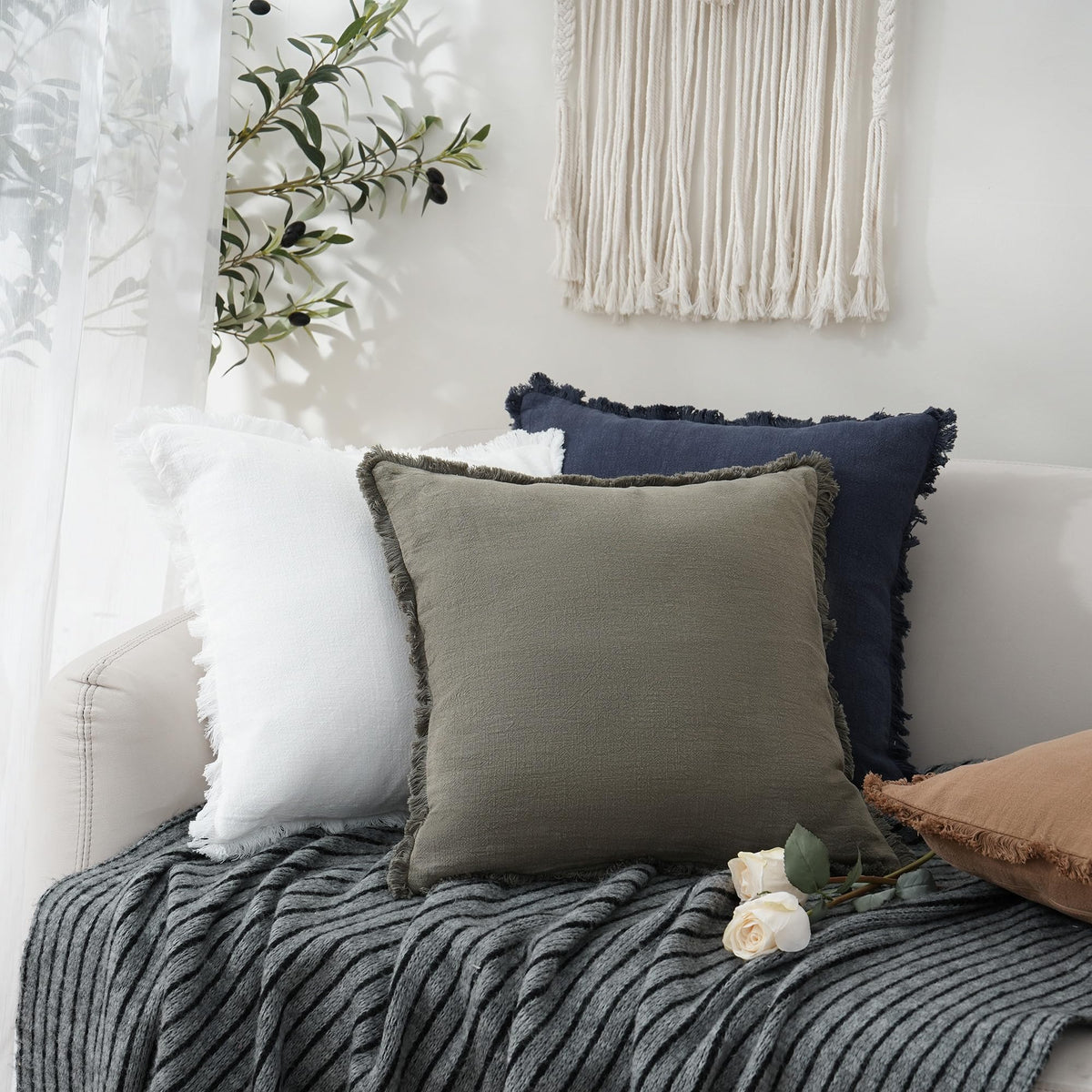 Foindtower living room decor with navy pillow boosts cozy appeal.