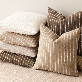 Foindtower decorative pillow cover in camel accentuates modern spaces.