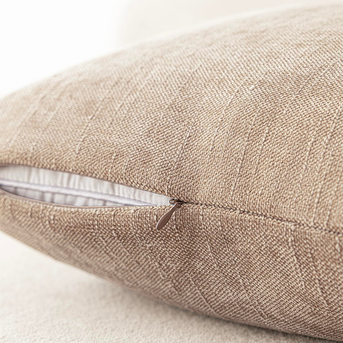 Foindtower slubby-weave pillow cover in cream complements neutral decor and elevates any seat.