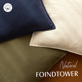 Foindtower pillow cover on a beige sofa enhances calm, neutral living room aesthetics.