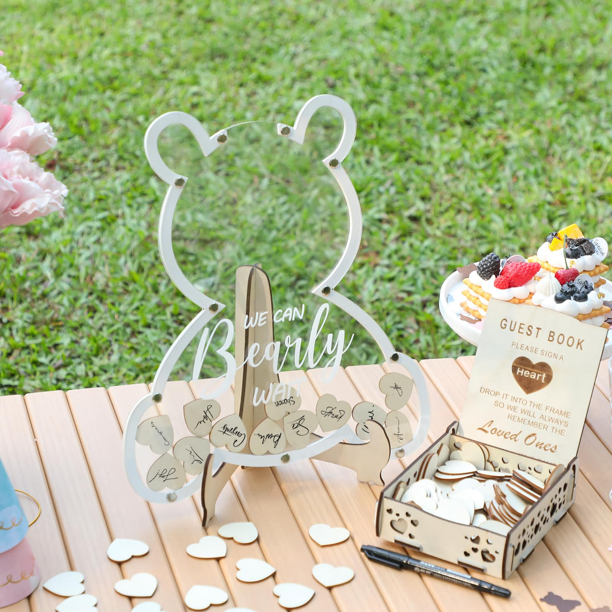 Fonder Mols wood heart drops provide tactile, charming signatures for a baby shower.