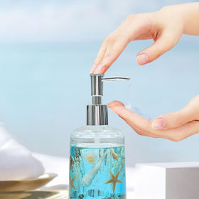 Front view of the blue seashell dispenser highlighting handmade detailing