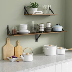 Forbena 24-inch floating shelves living room display with plants and keepsakes neatly organized.