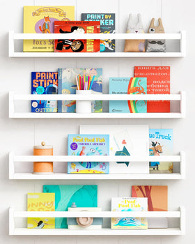 Forbena 24-inch wall shelf in white, organized kids' books and toys.
