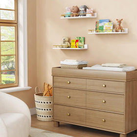 Forbena gold floating shelves with flowers and plants add color and organization.