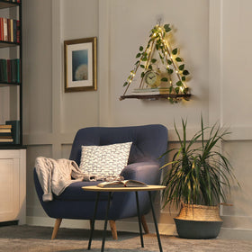 Forest Angle no-drill adhesive shelf displays items without wall damage, ideal for renters.