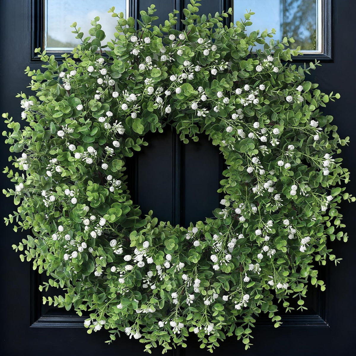 FOTEEWL 26-inch artificial eucalyptus wreath with baby’s breath on a welcoming front door for entry decor