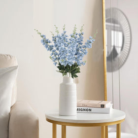 Fqueelvys artificial delphinium flowers brighten wedding decor without wilting.