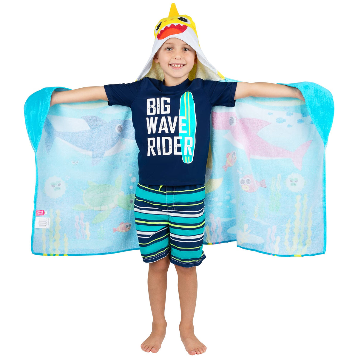 Franco Baby Shark hooded towel wrap worn as poncho for easy changing.