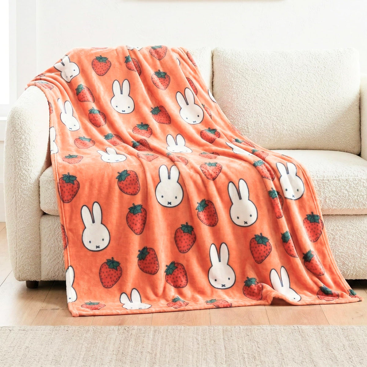Franco Miffy throw with face pattern adds playful charm and soft warmth to sofas.