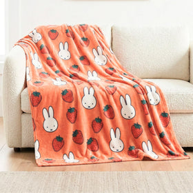 Franco Miffy throw with face pattern adds playful charm and soft warmth to sofas.