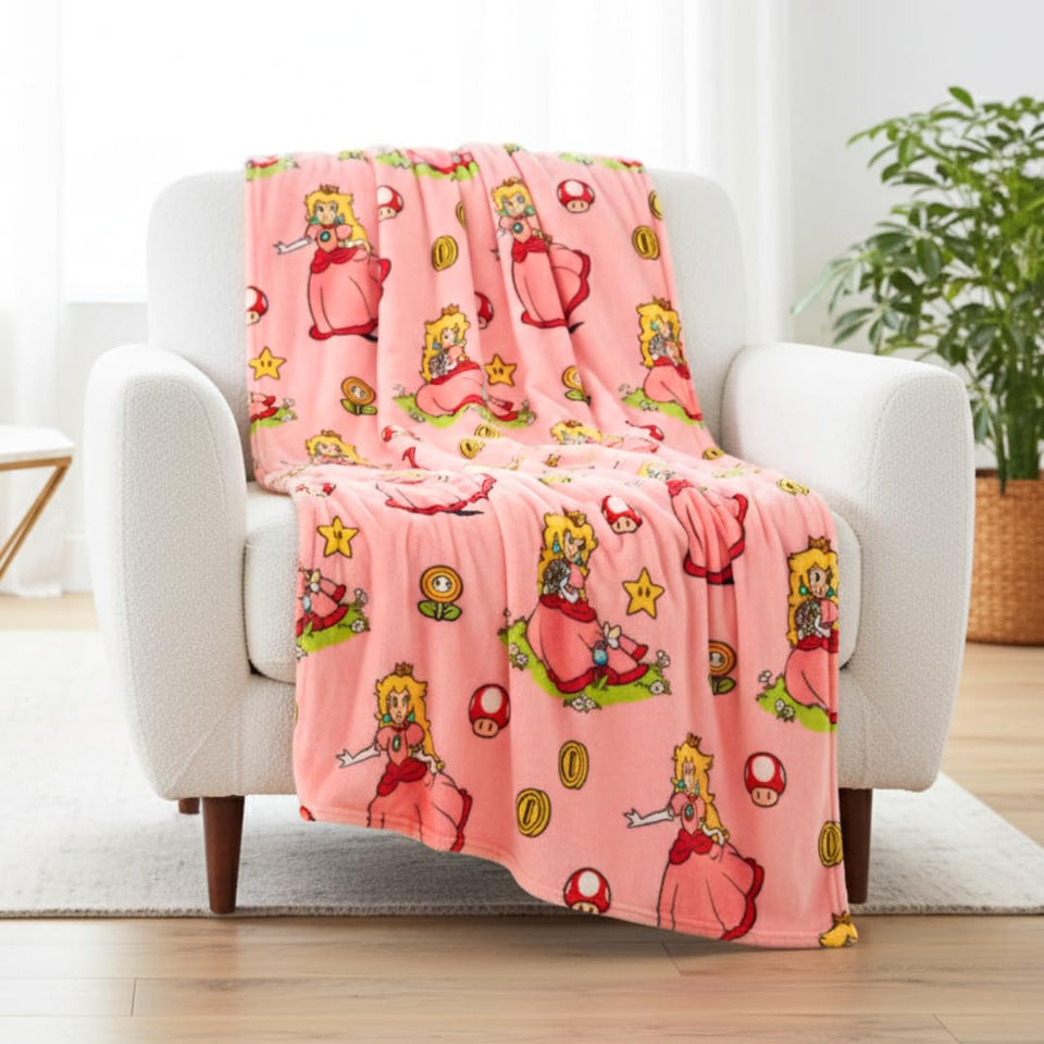 Franco Nintendo Princess Peach throw blanket showing Peach and Toad for cozy gaming nights.