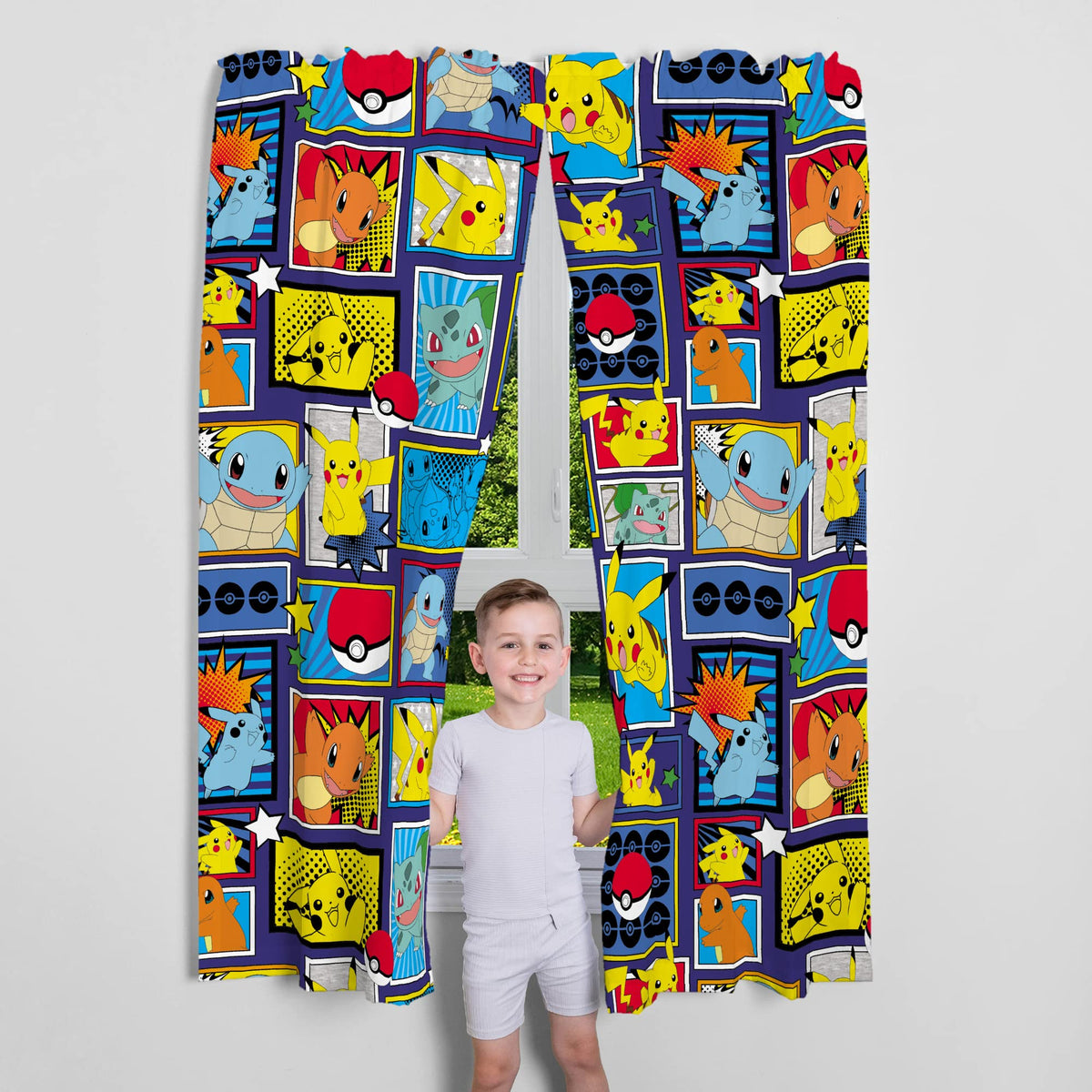 Franco Pokemon curtains featuring Charmander on blue background for themed bedroom.