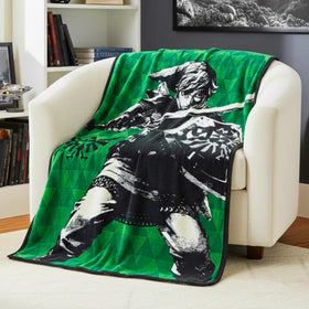 Franco Zelda Link throw on green background, ideal for cozy couch sessions.