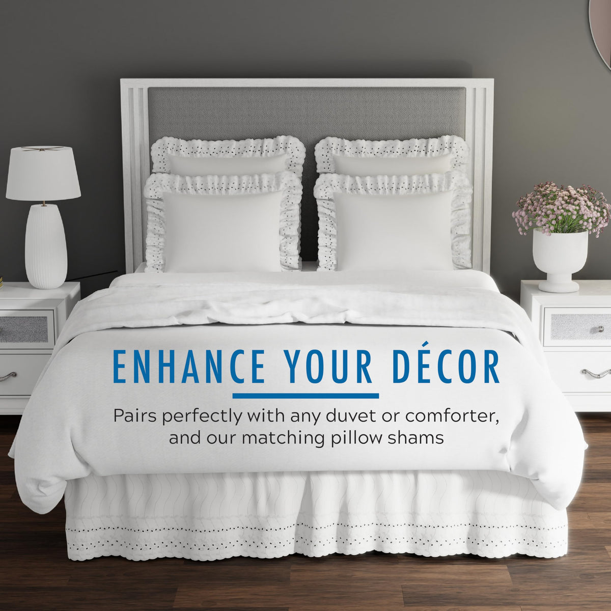 Scalloped edge and delicate embroidery elevate the bed's finished look.