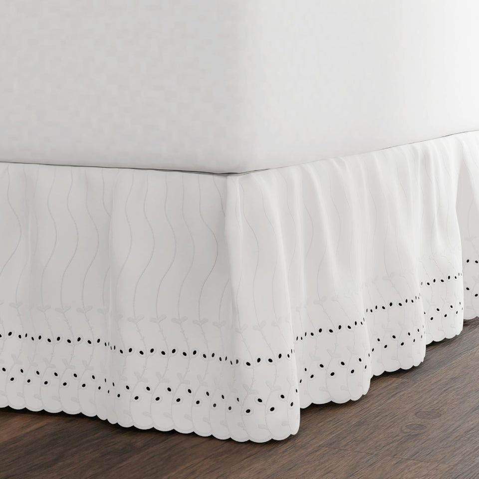 Fresh Ideas Eyelet Bed Skirt with a ruffled edge adds elegant coverage to a queen bed.