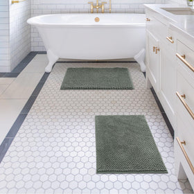 Sage green color complements modern bathroom decor.
